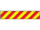 Laminated warning tape, red and yellow chevron.