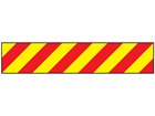 Laminated warning tape, red and yellow chevron.