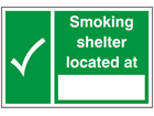 Smoking shelter located at sign