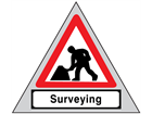 Men at work, surveying roll up road sign