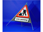 Men at work, line painting roll up road sign