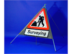 Men at work, surveying roll up road sign