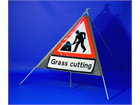 Men at work, grass cutting roll up road sign