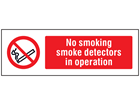 No smoking, smoke detectors in operation safety sign.