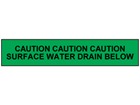 Caution surface water drain below tape.