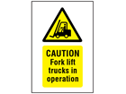 Caution Fork lift trucks in operation symbol and text safety sign.