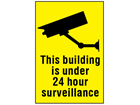 This building is under 24 hour surveillance sign