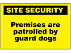 Premises are patrolled by guard dogs sign