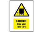 Caution blind spot take care symbol and text safety sign.