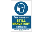 Face masks are still mandatory in this area safety sign.