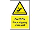 Caution Floor slippery when wet symbol and text sign