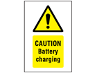 Caution Battery charging symbol and text safety sign.