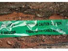 Caution fibre optic cable below tape.