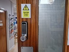 Caution Oxygen in use symbol and text safety sign.