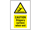 Caution Slippery surface when wet symbol and text safety sign.