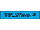 Caution brine water main below tape.