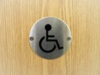 Disabled symbol door sign.