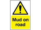 Mud on road warning sign.