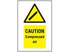 Caution Compressed air symbol and text safety sign.