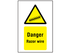 Danger razor wire symbol and text sign.