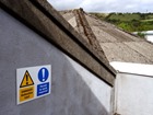 Danger Asbestos roof, Permit to work required safety sign.