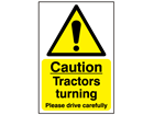 Caution, tractors turning, please drive carefully safety sign.