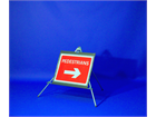 Pedestrians (arrow right) roll up road sign