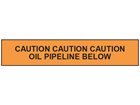 Caution oil pipeline below tape.