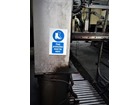 Foot protection must be worn in this area symbol and text safety sign.