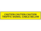 Caution traffic signal cable below tape.