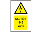 Caution 440 volts symbol and text safety sign.