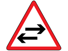 Two-way traffic crosses one way road sign