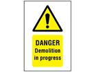 Danger Demolition in progress symbol and text safety sign.