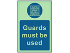 Guards must be used photoluminescent safety sign