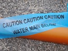 Caution water main below tape.