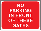 No parking in front of these gates temporary road sign.