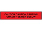 Caution gravity sewer below tape.