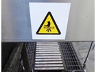 Belt roller hazard symbol safety sign.