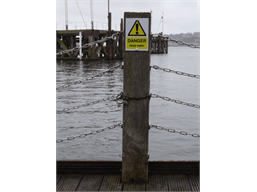 Caution, Deep water symbol and text safety sign.