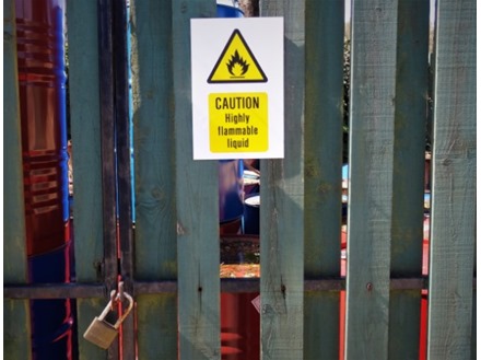 Caution highly flammable liquid symbol and text safety sign.