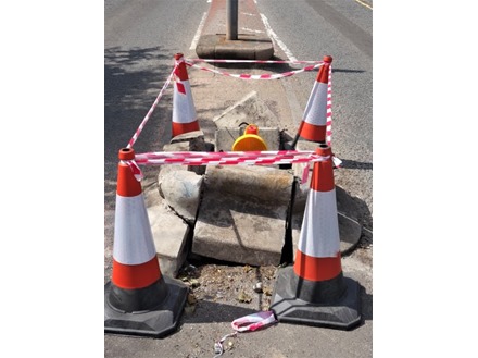 Heavy duty barrier tape, red and white chevron.