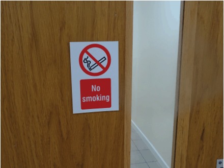 No smoking symbol and text safety sign.