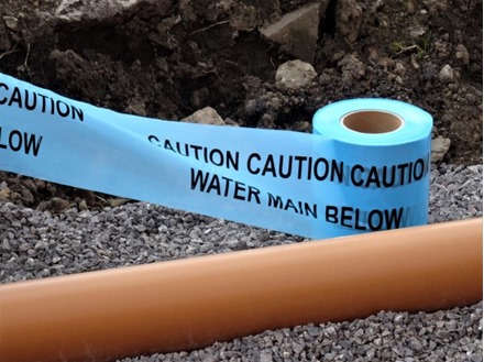 Caution water main below tape.