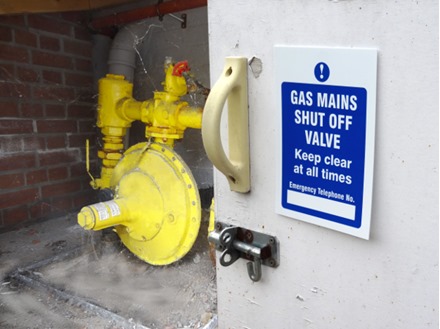 Gas mains shut off safety sign.