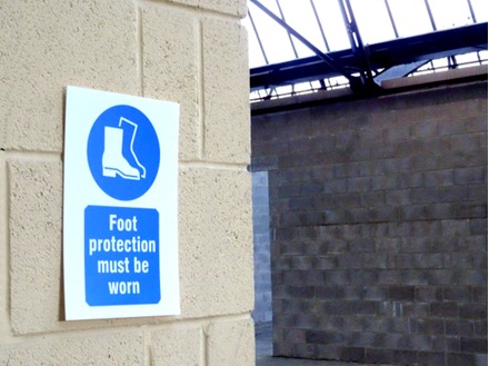 Foot protection must be worn symbol and text safety sign.