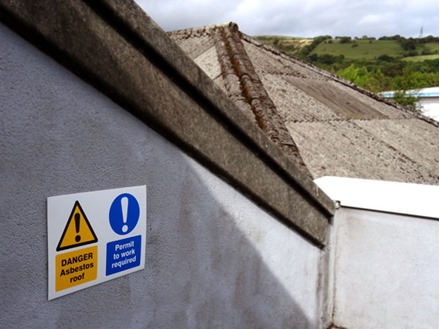 Danger Asbestos roof, Permit to work required safety sign.