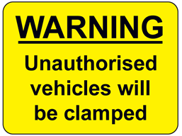 Warning Unauthorised vehicles will be clamped sign