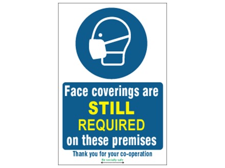 Face coverings are still required on these premises safety sign.