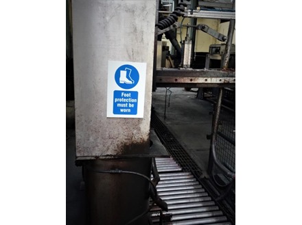 Foot protection must be worn in this area symbol and text safety sign.