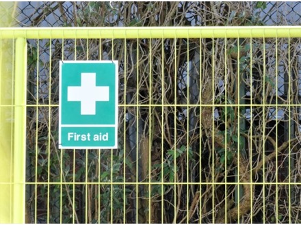 First aid symbol and text safety sign.